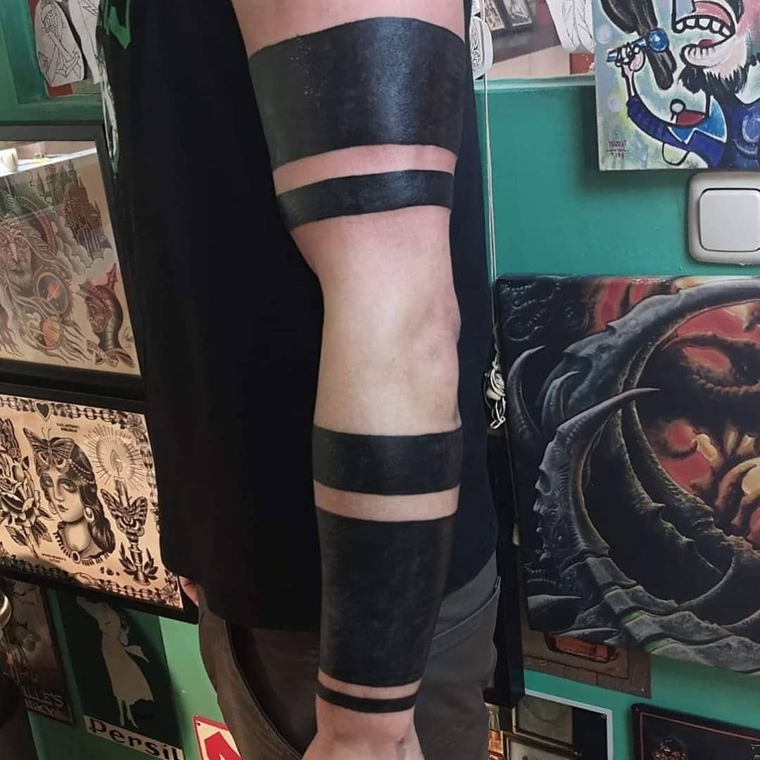 What Is The Meaning Behind A Solid Black Arm Band Tattoo? - Psycho Tats