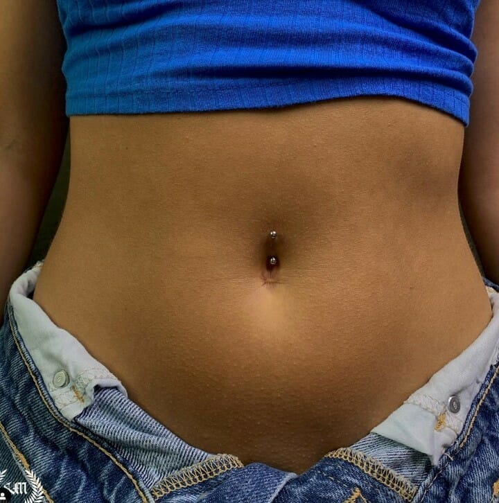 Can You Swim With A Belly Button Piercing? Psycho Tats