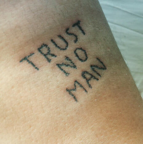 39 Statement Making “Trust No Man” Tattoo Designs - Psycho Tats